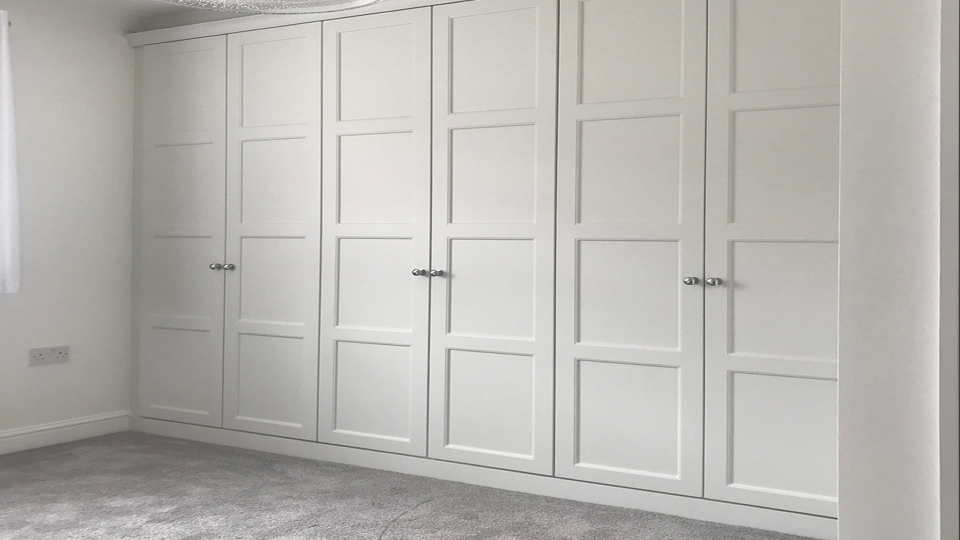 Room fitted white wardrobe